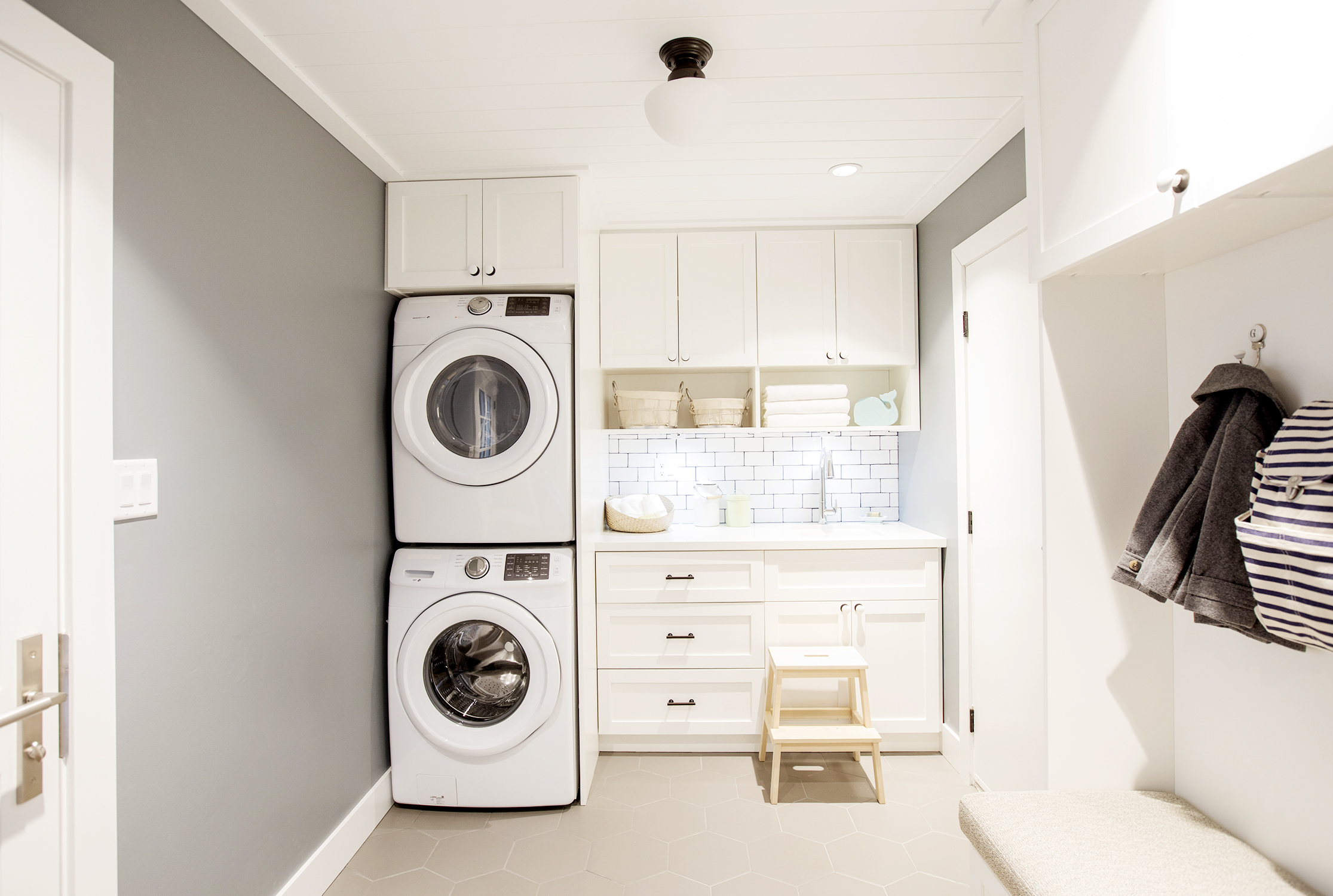 Modern white laundry room design by Jillian Harris.