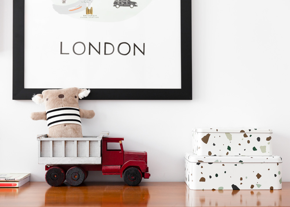 framed london art and toy vignette in kids room