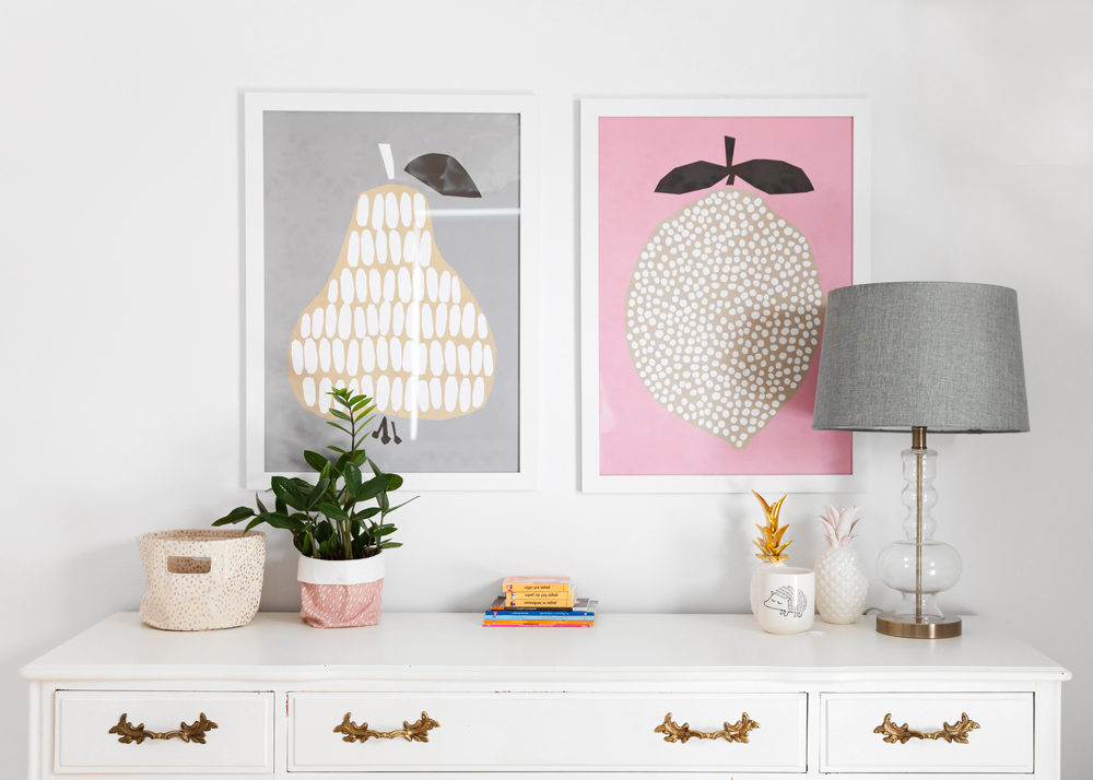 graphic pear and lemon artwork above vintage dresser
