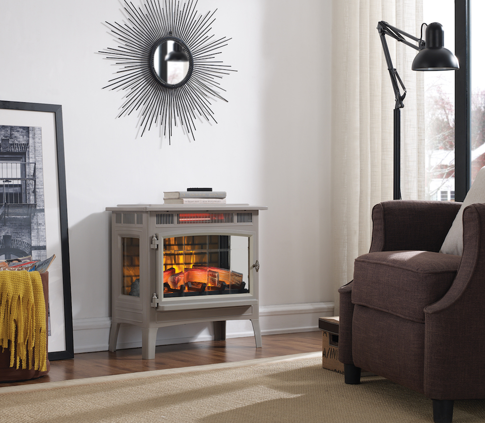 Electric fireplace in living room with sunburst mirror