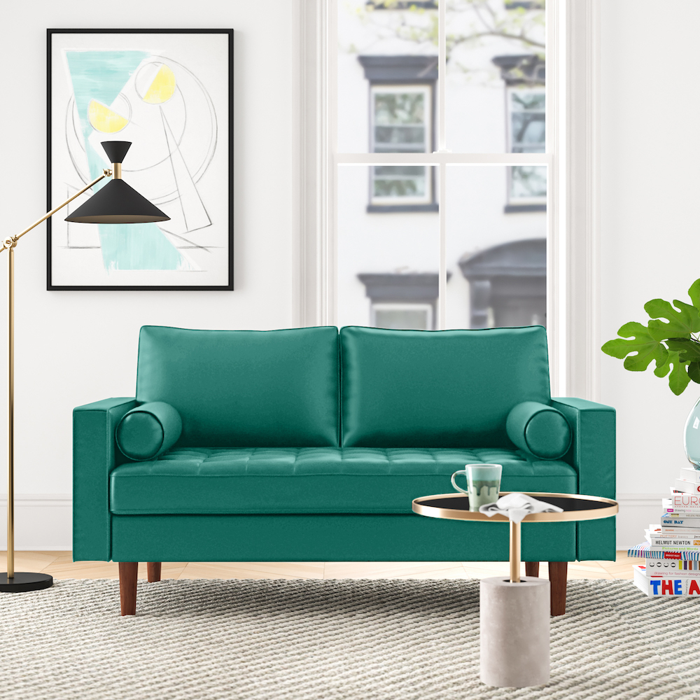 Emerald green sofa in living room with modern furnishings