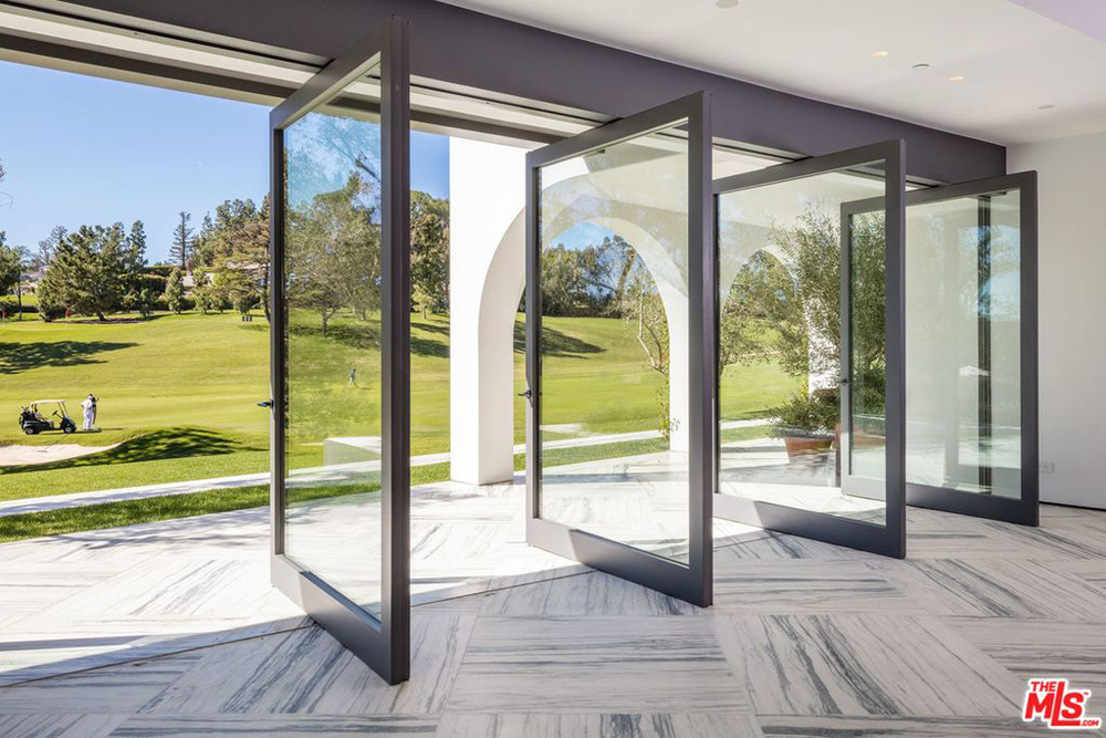 Sliding French doors leading out to a patio looking out onto the golf course