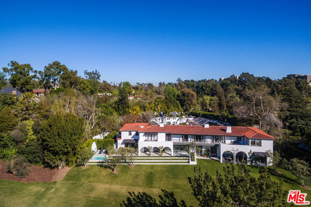 The exterior shot of a Bel-Air mansion alongside a golf course