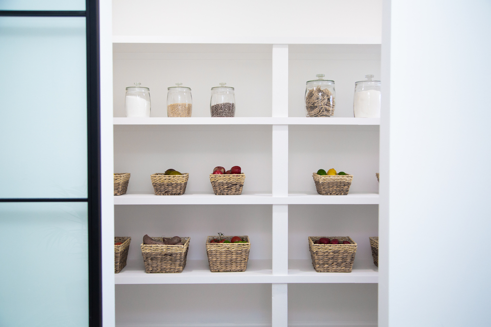 Large and bright pantry with baskets and jars