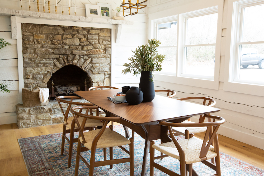 Dining room with stone fireplace