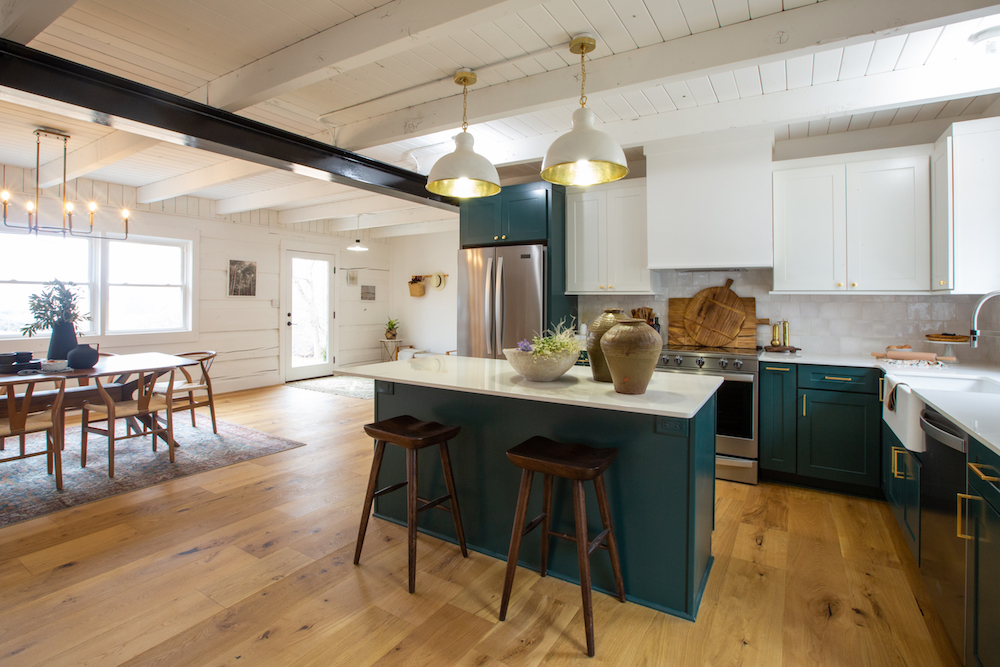 Kitchen with green jewel island and cabinets