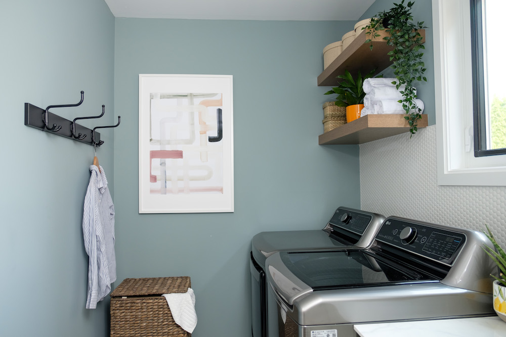 Laundry room with blue walls and white accents