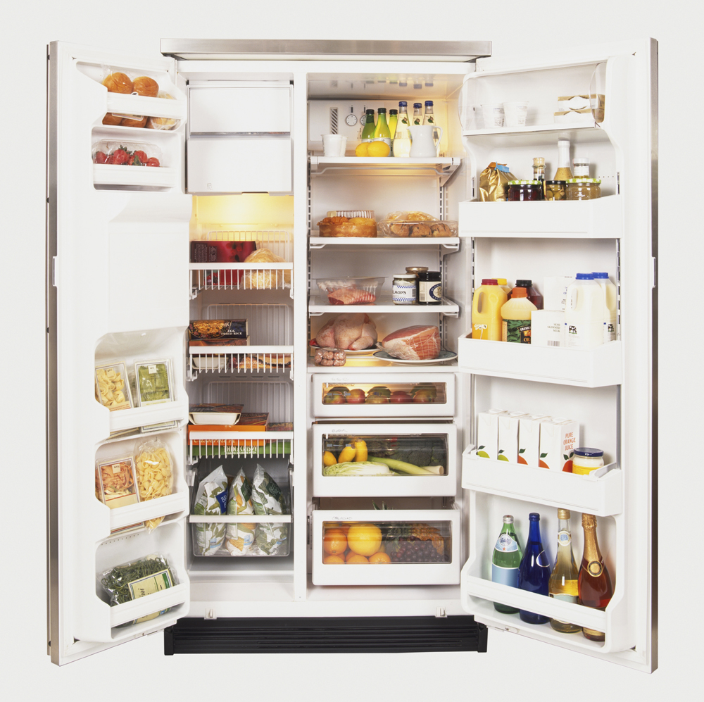 A fridge filled with fruits, vegetables, drinks and assorted snacks