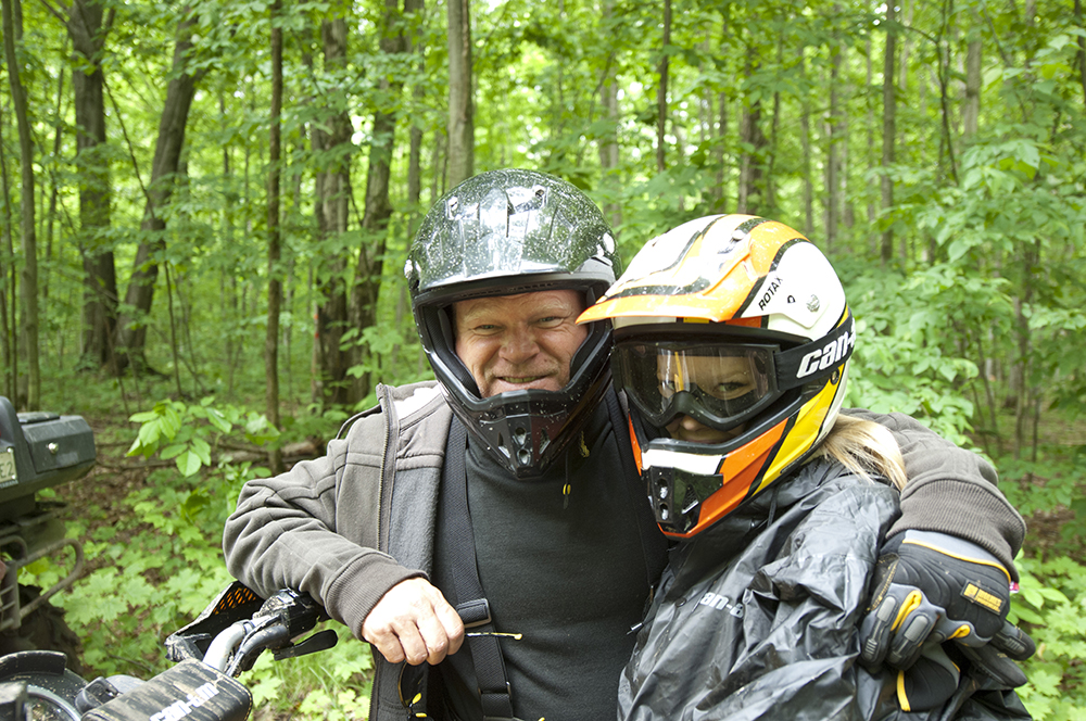 Mike Holmes and Sherry Holmes on ATVs