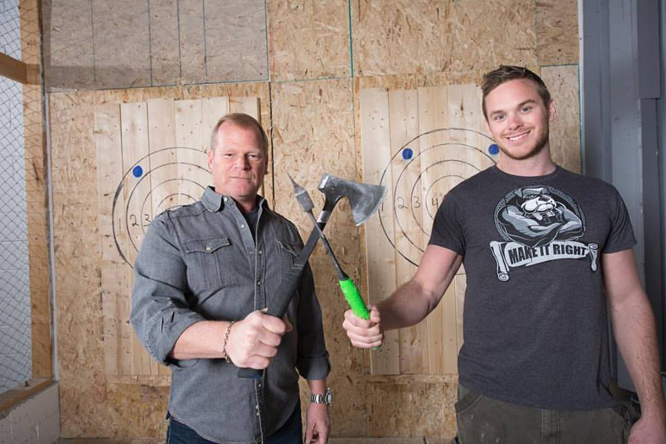 Mike Holmes and Mike Holmes Jr at axe throwing
