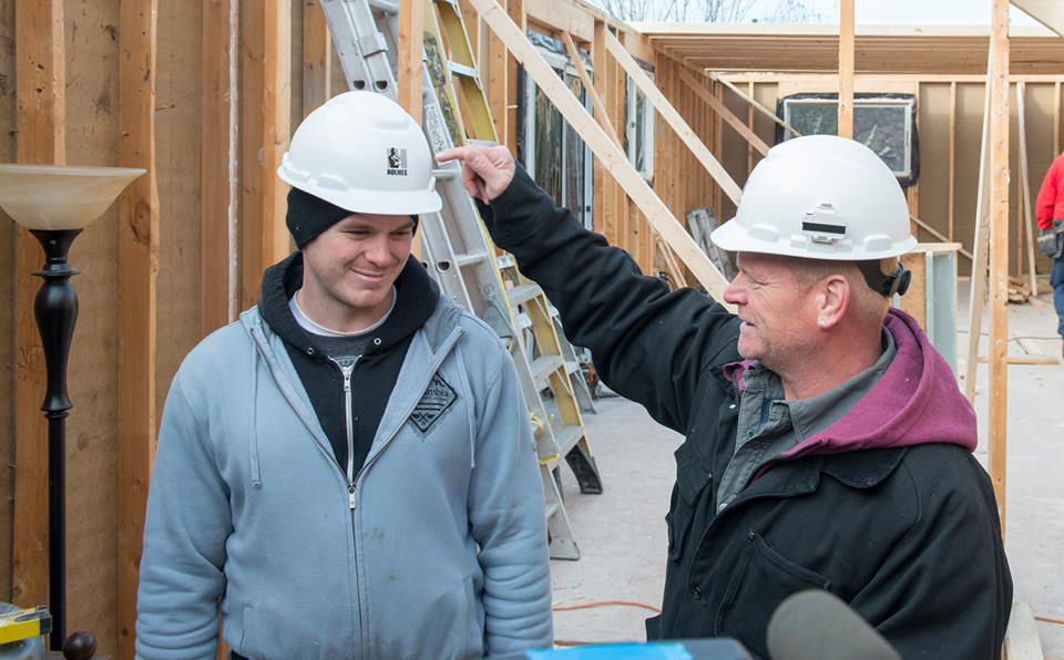 Mike Holmes and Mike Holmes Jr on set