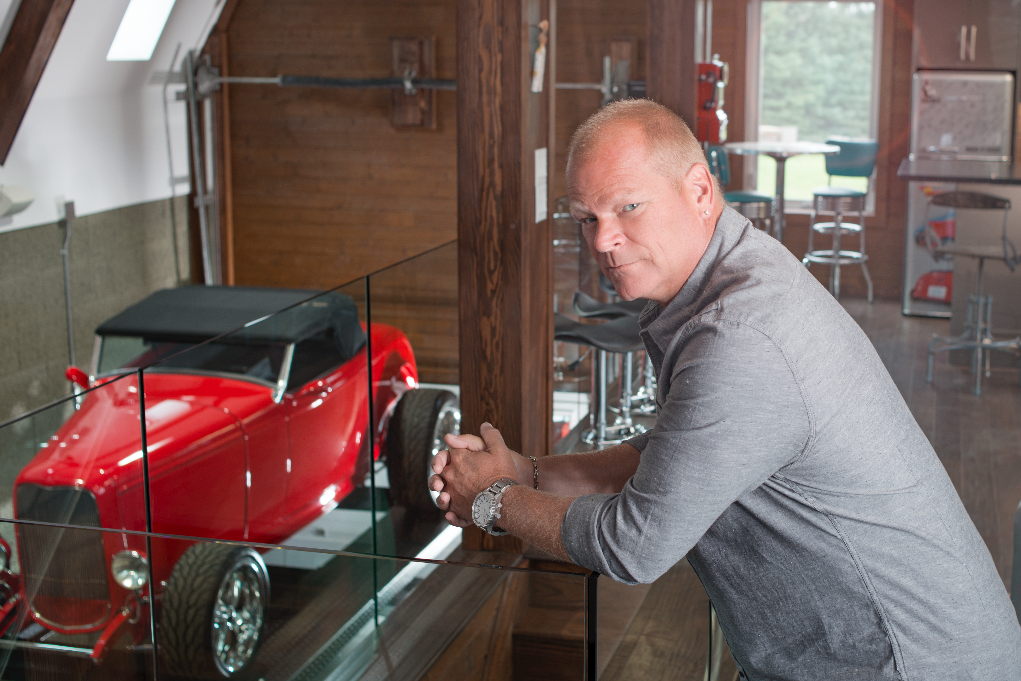 Mike Holmes in a garage