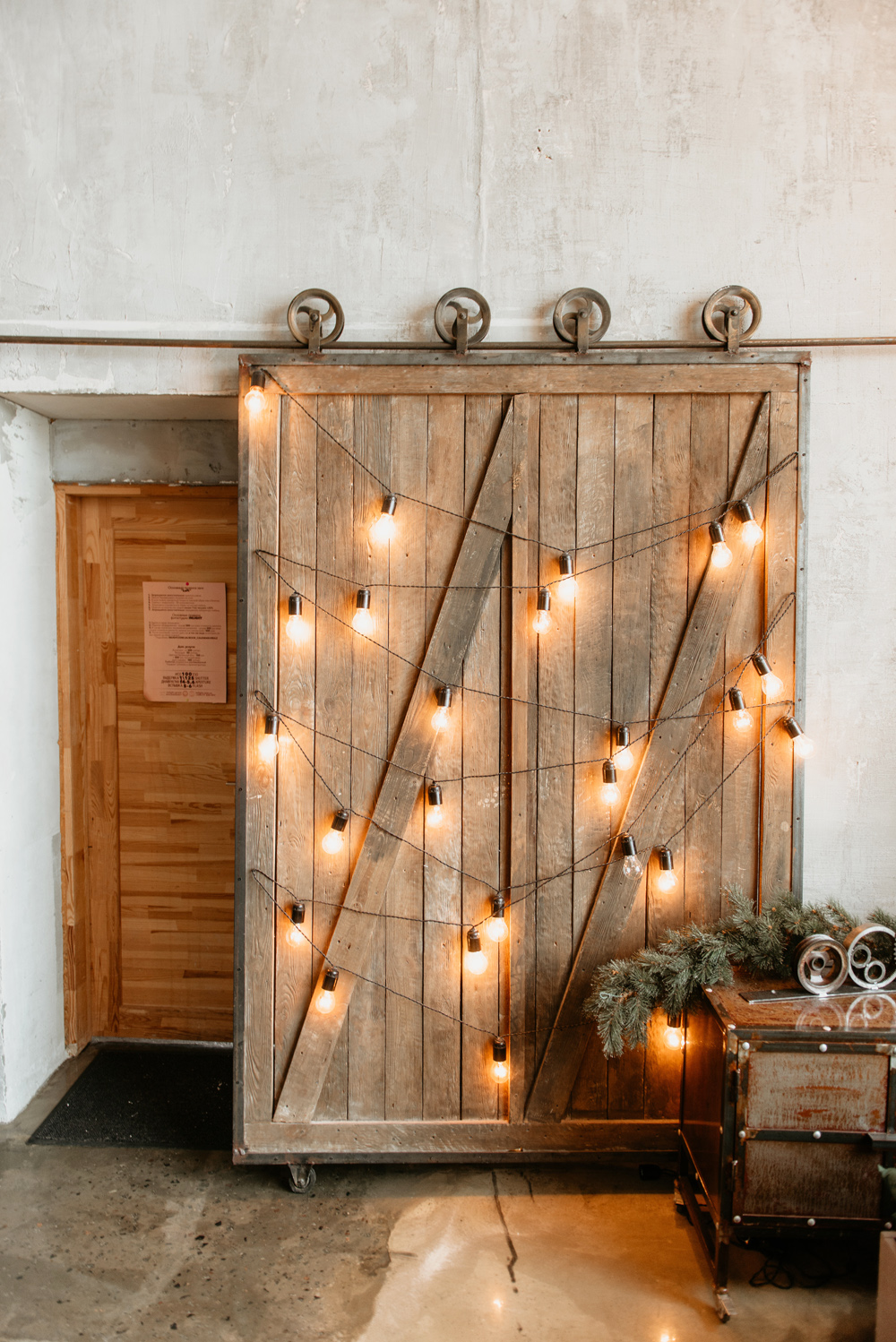 Warm white string lights mounted on a sliding farmhouse kitchen door