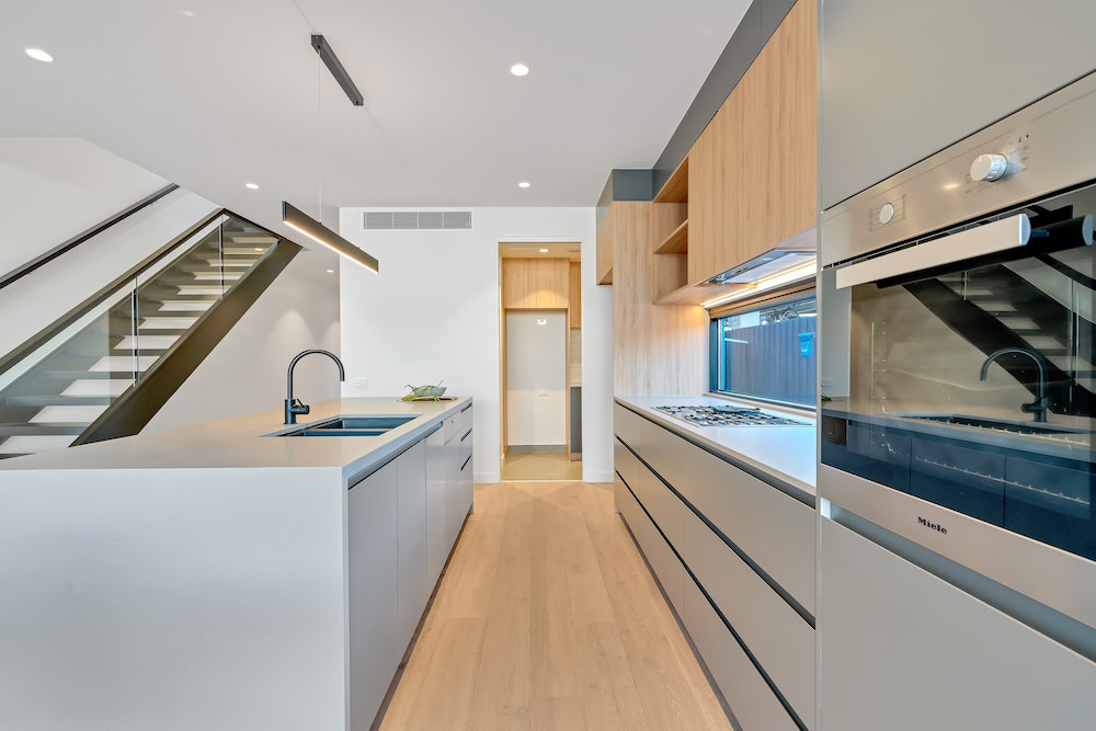 minimal kitchen with hardware-free cabinets