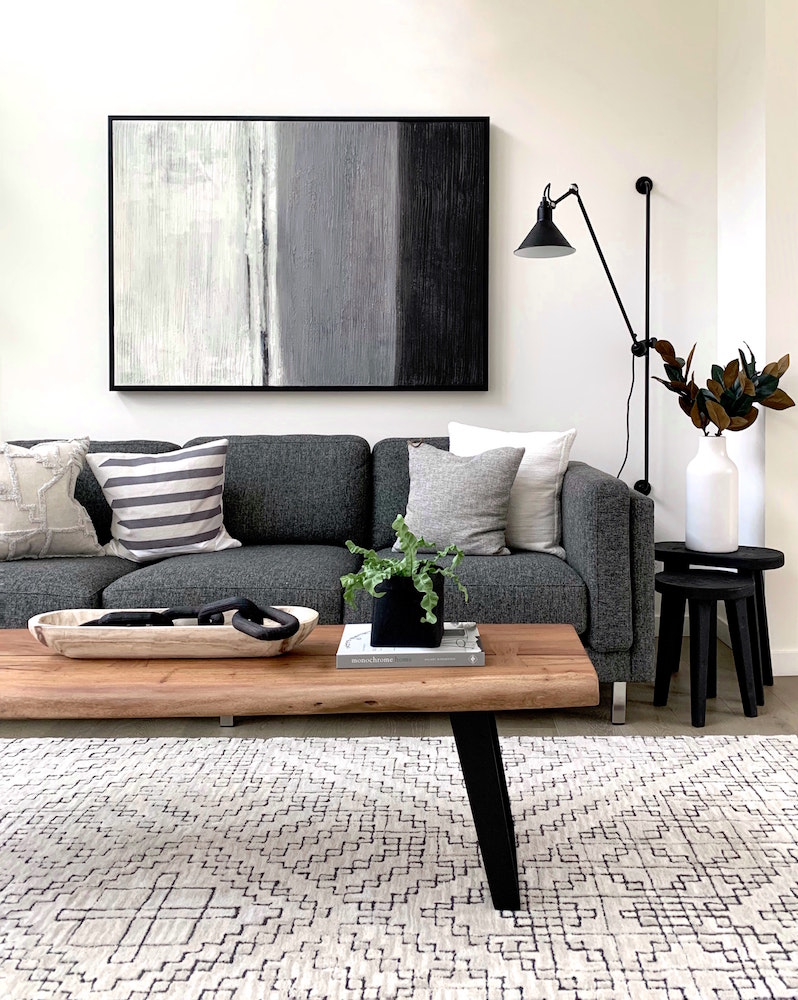 living room with white, black and charcoal furniture