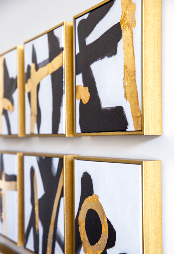 Closeup of the gold graffiti art hanging in the dining room