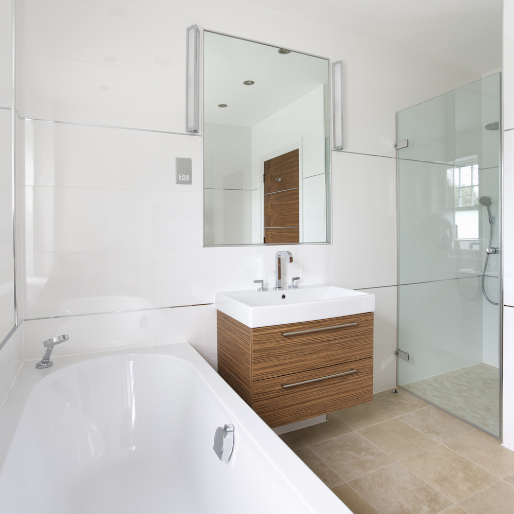modern white bathroom with walnut-wood floating vanity