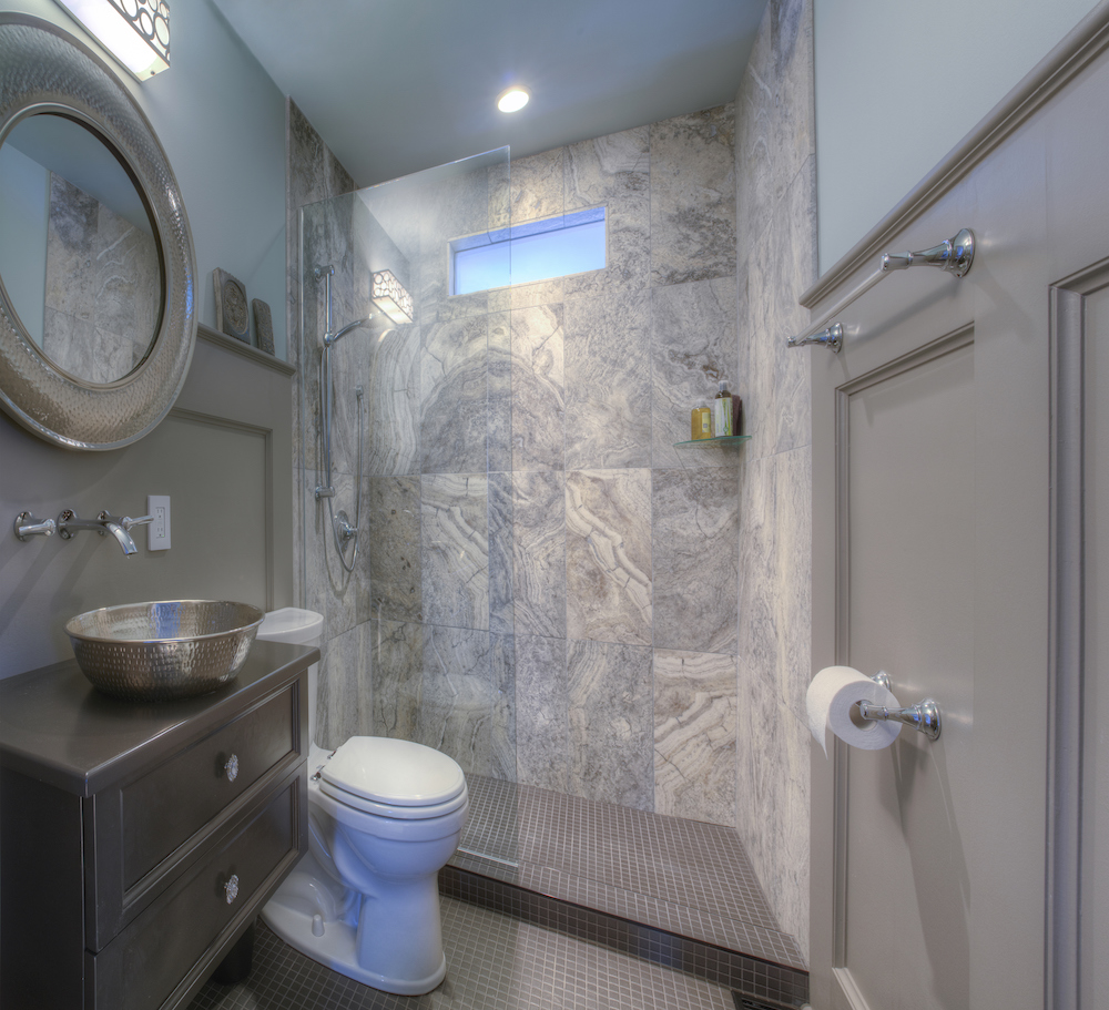 modern grey bathroom with glass-wall shower