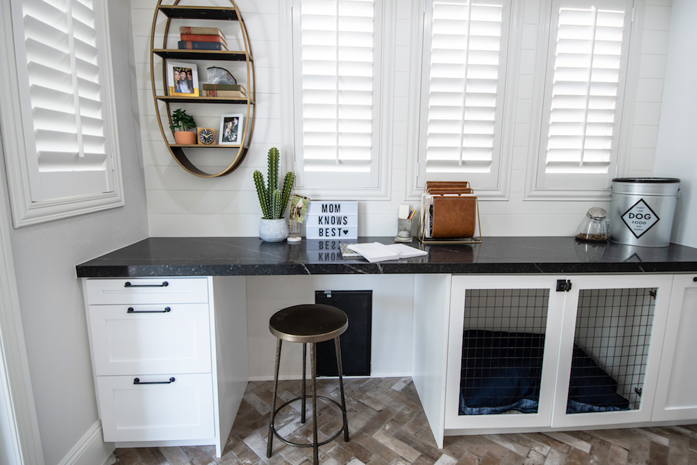 The pops of gold, chevron floor riles and brick finish countertops elevate this space beyond the average mudroom and pet-lovers will appreciate this clever built-in kennel