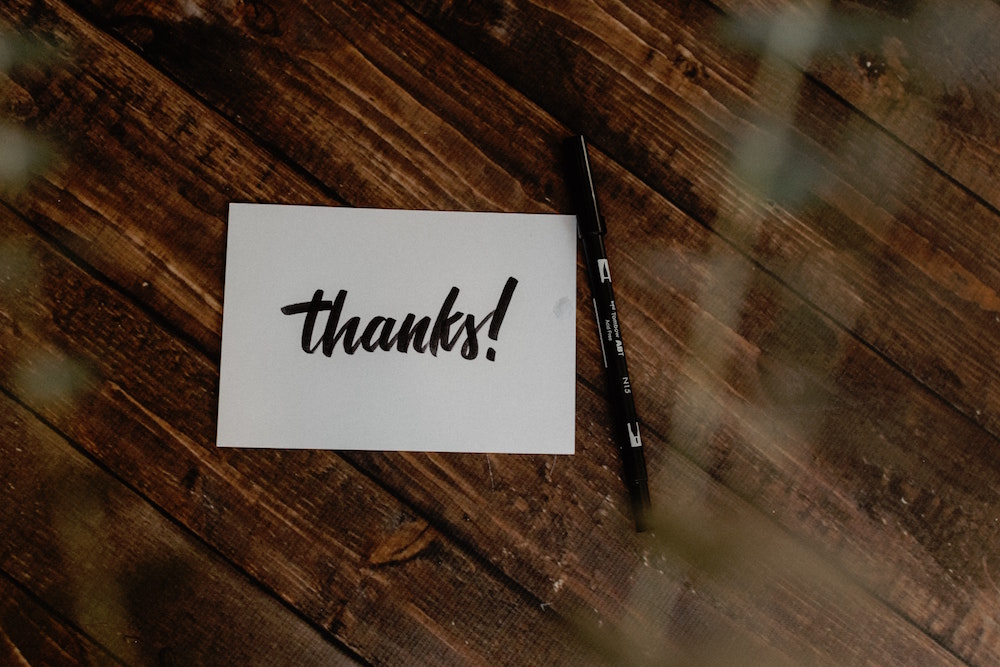 thank you card on wood table