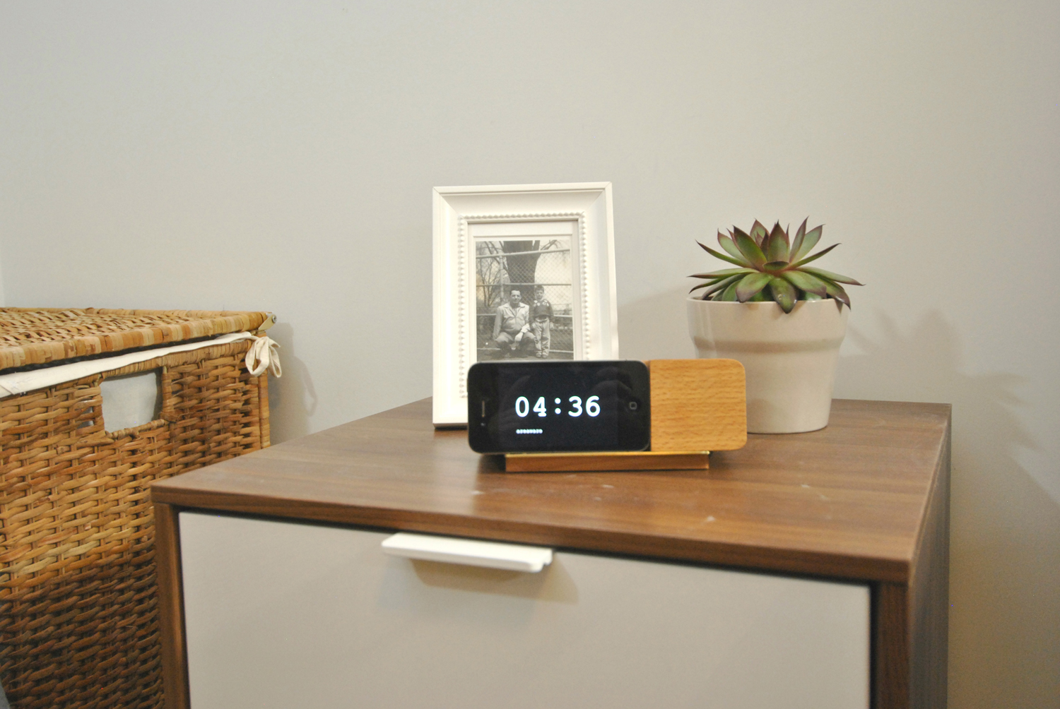A simple nightstand in the basement apartment bedroom