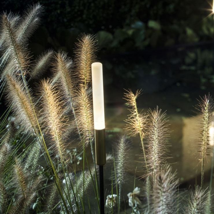 Glowing light wand in garden