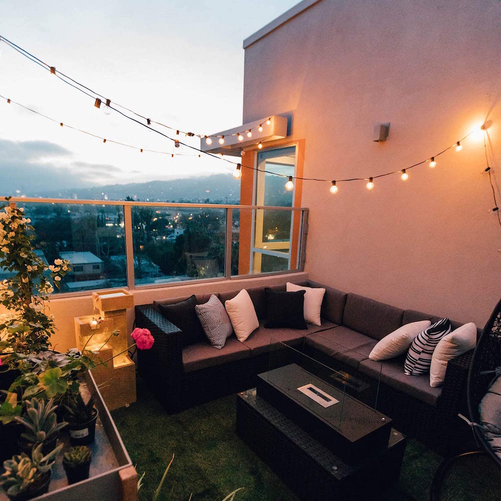 string lights over outdoor living area on patio
