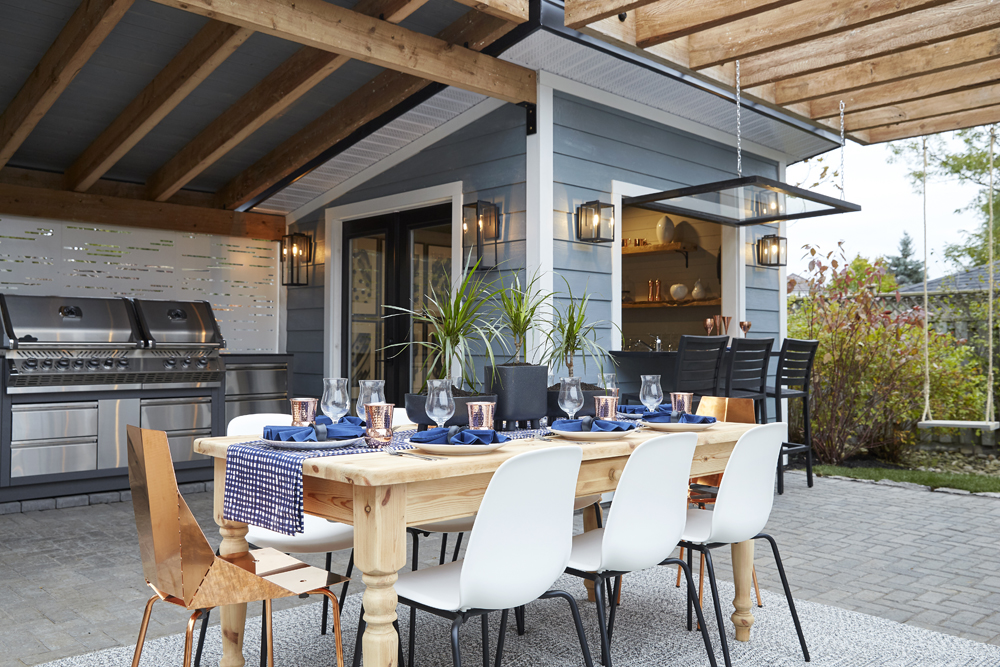 outdoor kitchen with wooden dining table