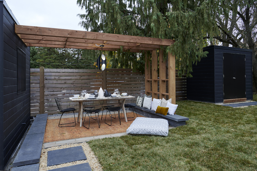 wooden pergola over modern outdoor dining area