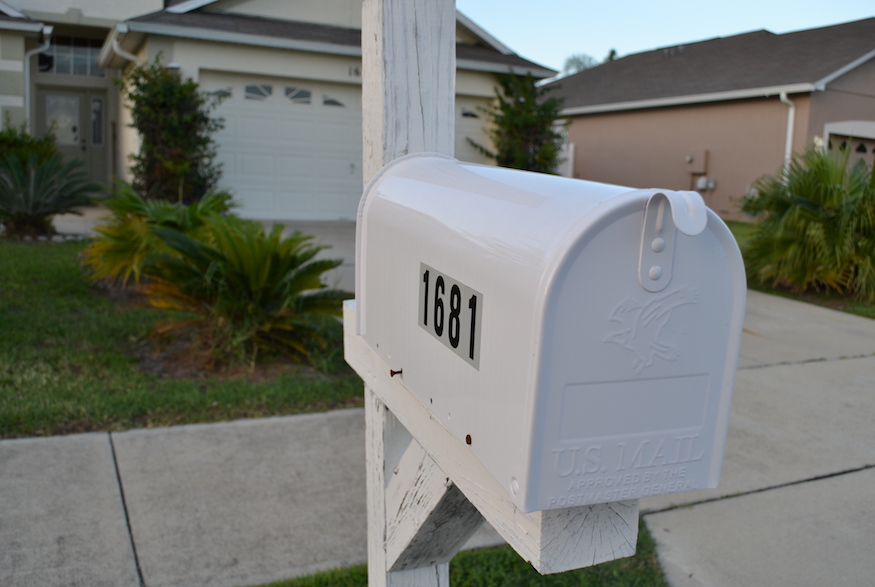 White-painted mailbox on residential street