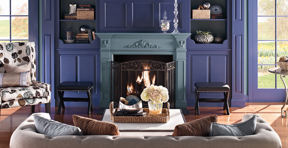 eclectic blue living room with painted fireplace