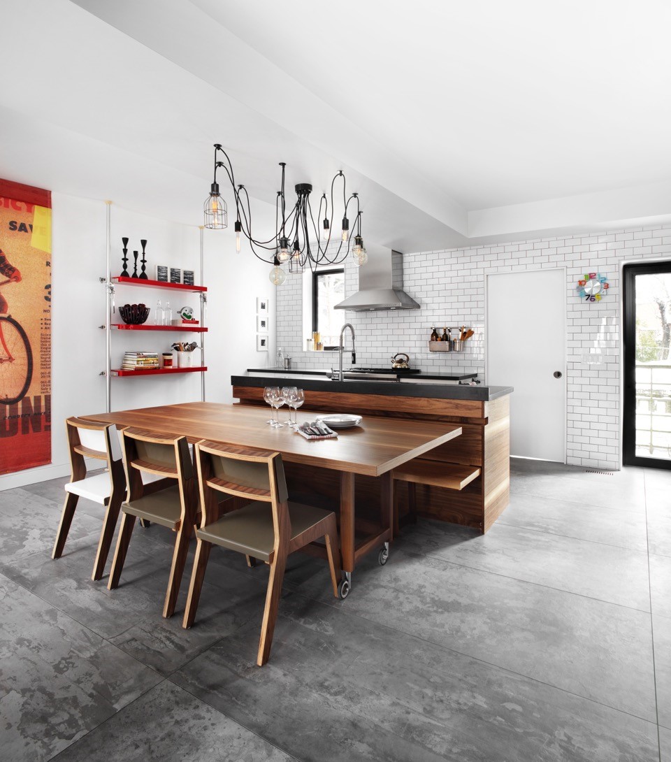 Modern and eclectic cooking space with functional kitchen island.