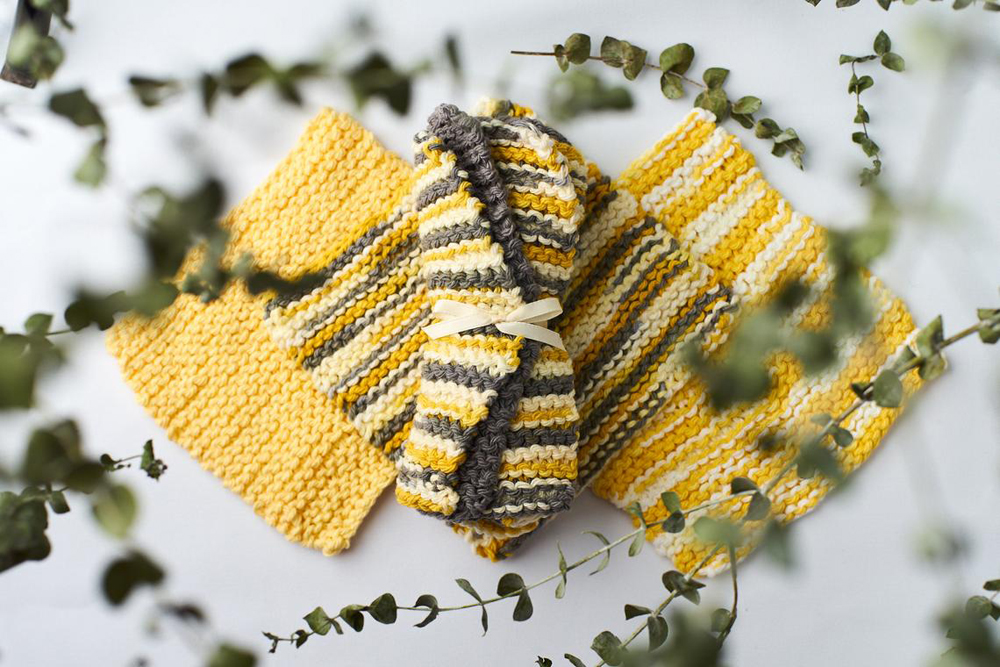 A bundle of yellow and gray reusable handmade dish cotton dish cloths