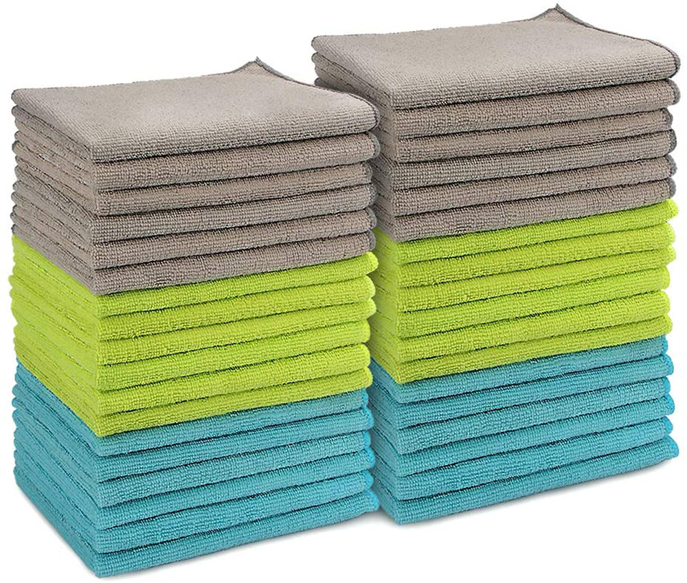 A stack of grey, green and blue Microfiber Cleaning Cloths against a white background