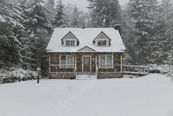 country house covered in snow