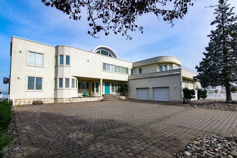 Exterior of a white 7,200-square-foot mansion in Jersey Shore