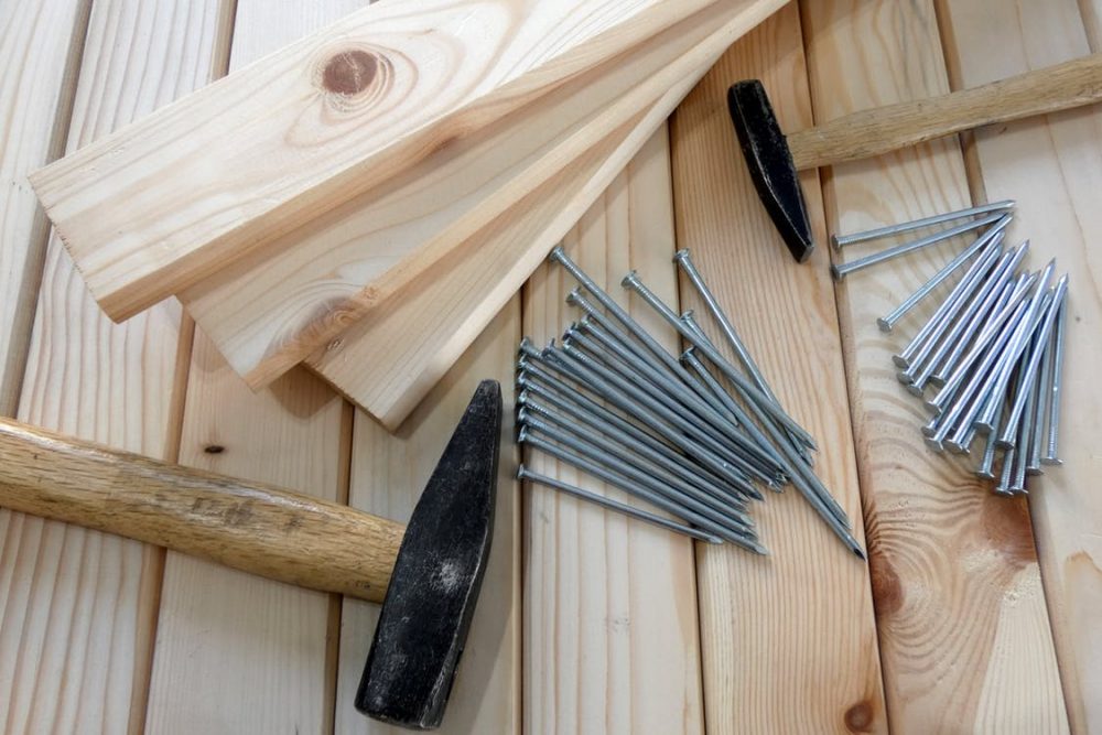 Nails, wood and hammers for winter renovations