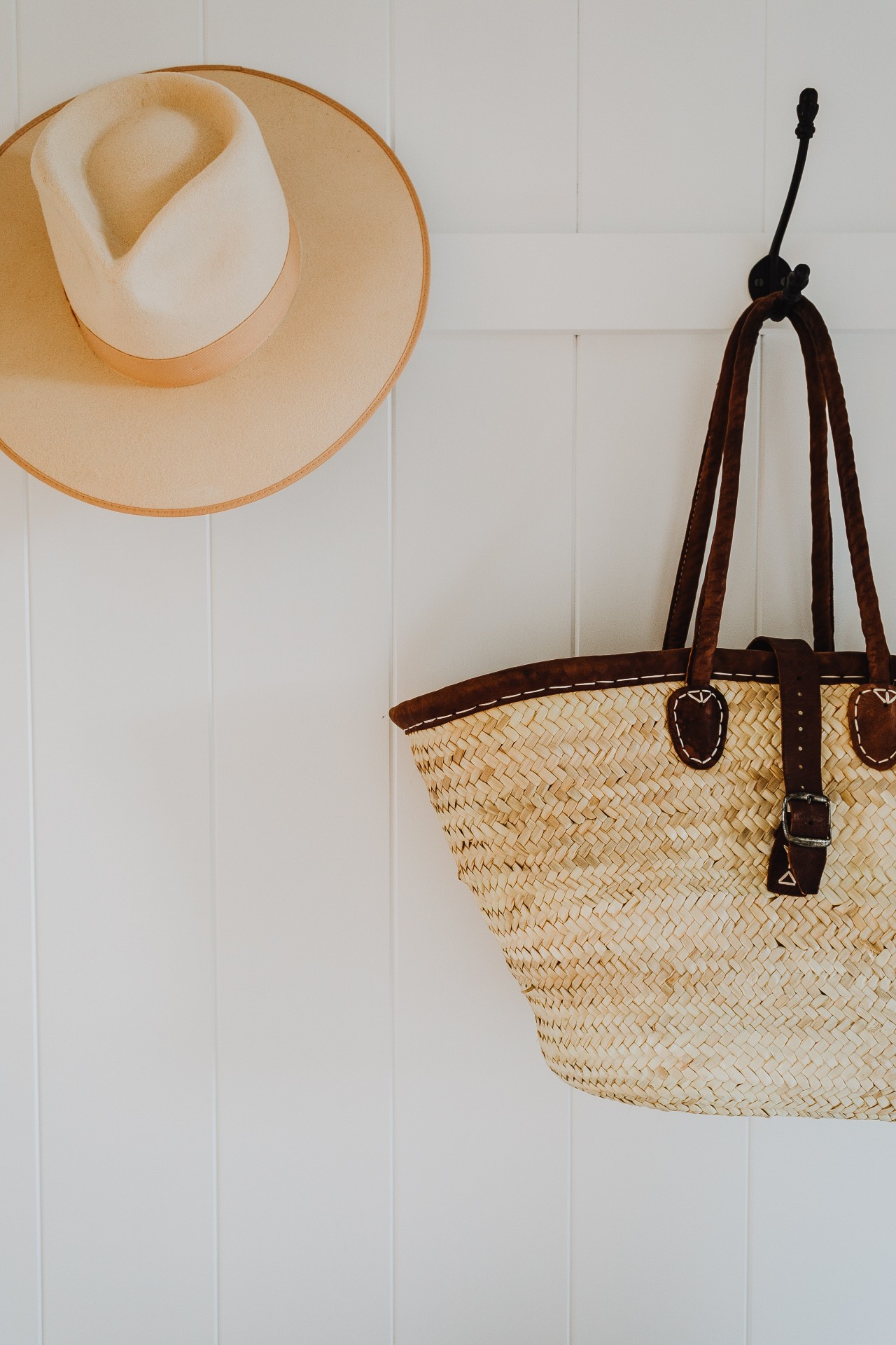 Hat and straw bag on a hook