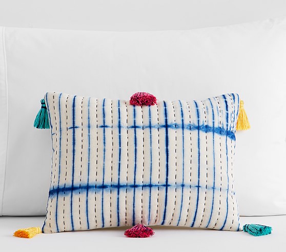 blue stripey pillow with tassels