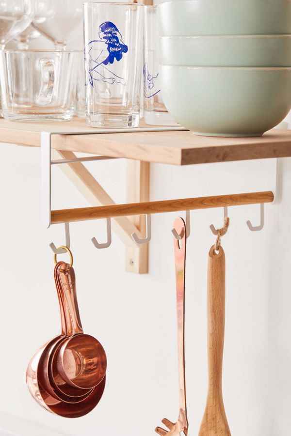 wooden rack with kitchen utensils
