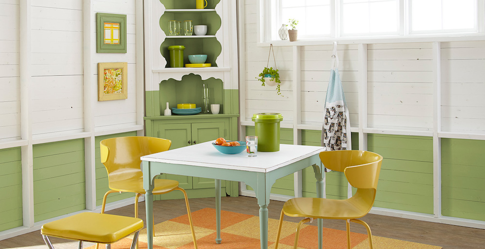 green and white cottage dining room with colourful furniture