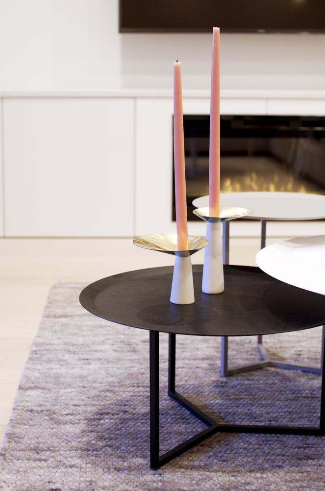 Despite their angular bases, these round nesting tables serve as a dynamic counterpoint