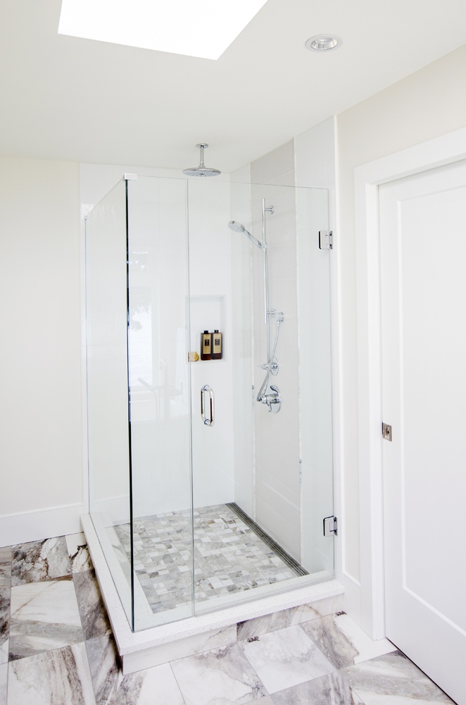Modern glass-enclosed shower with sleek finishes.