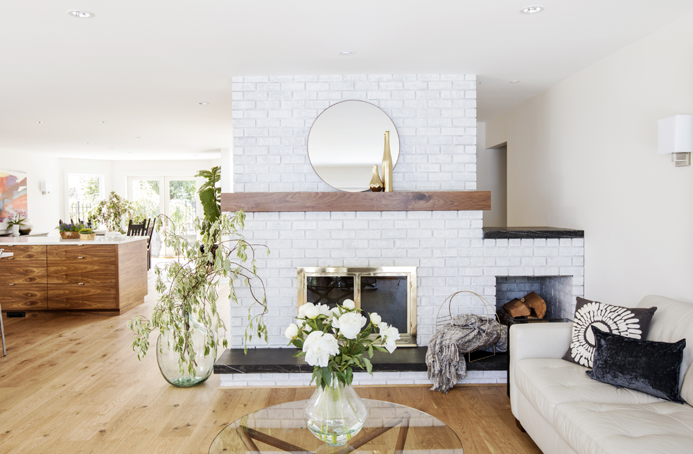 Rachelle gave the wood-burning fireplace a West Coast makeover