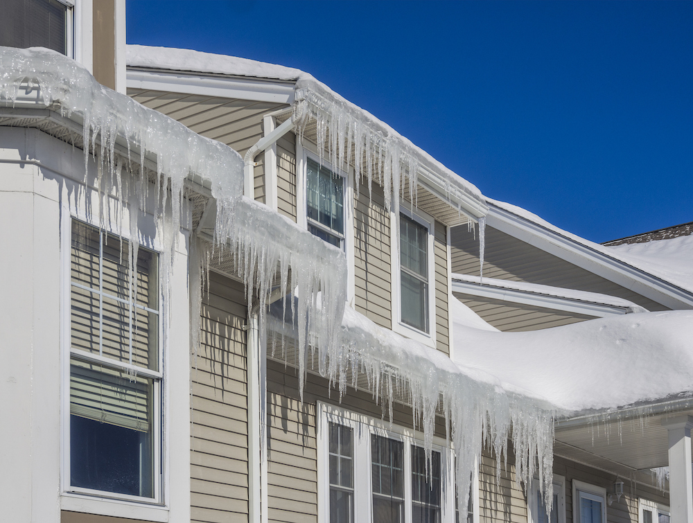 Exterior of a house with icicles hanging from the windows