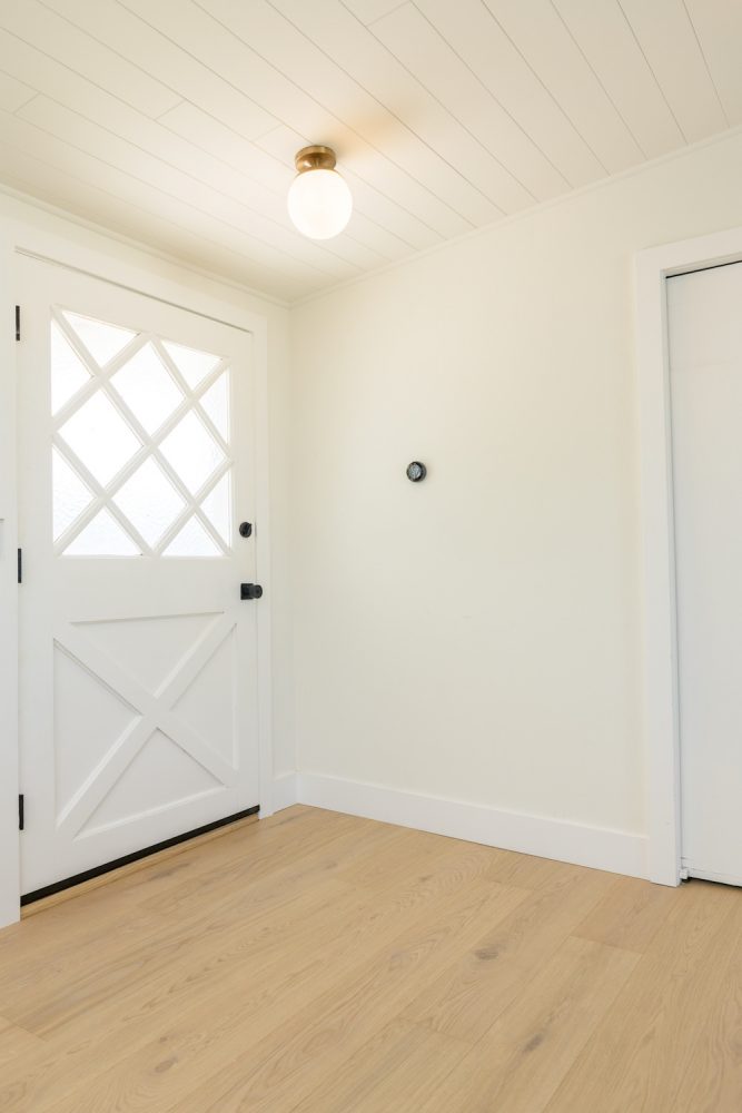 clean, bright front entryway with white front door