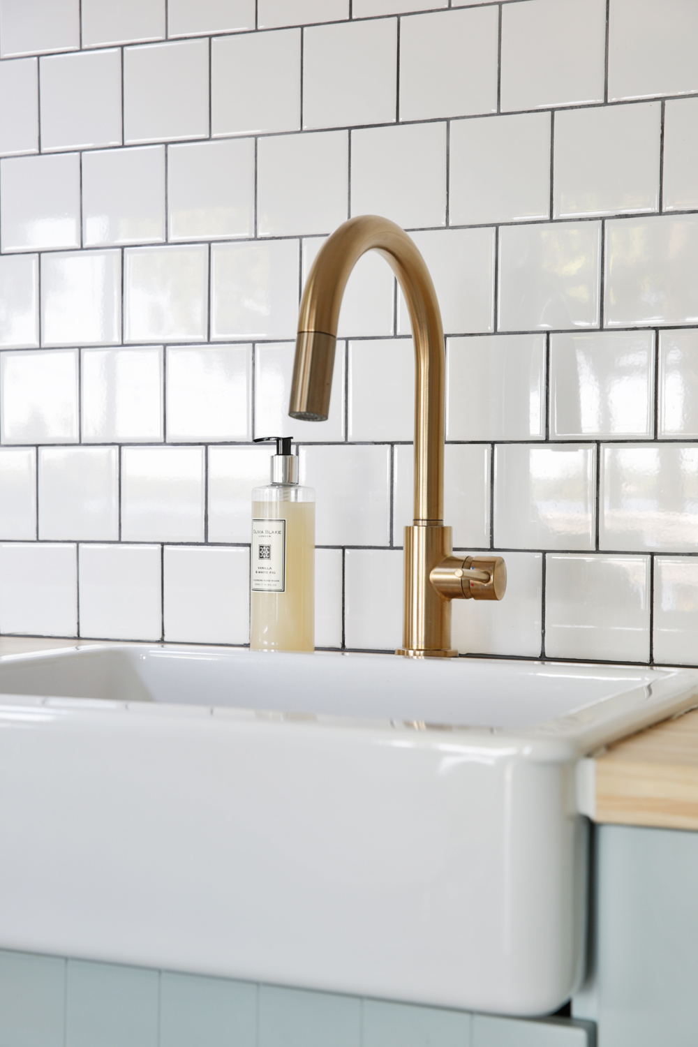 A brass kitchen sink faucet