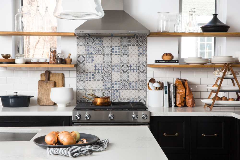 Vinyl decal made to look like a tiled backsplash in the kitchen behind the stove
