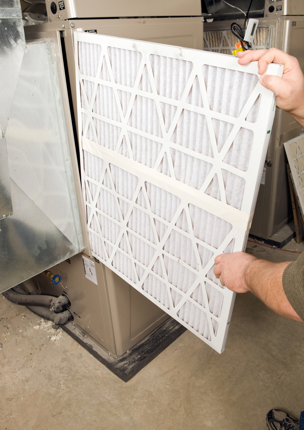 Male Hands Change Large Pleated Furnace Air Filter