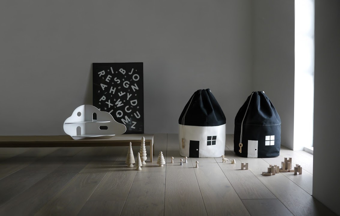 Stylish house-shaped storage bags for kids' room.
